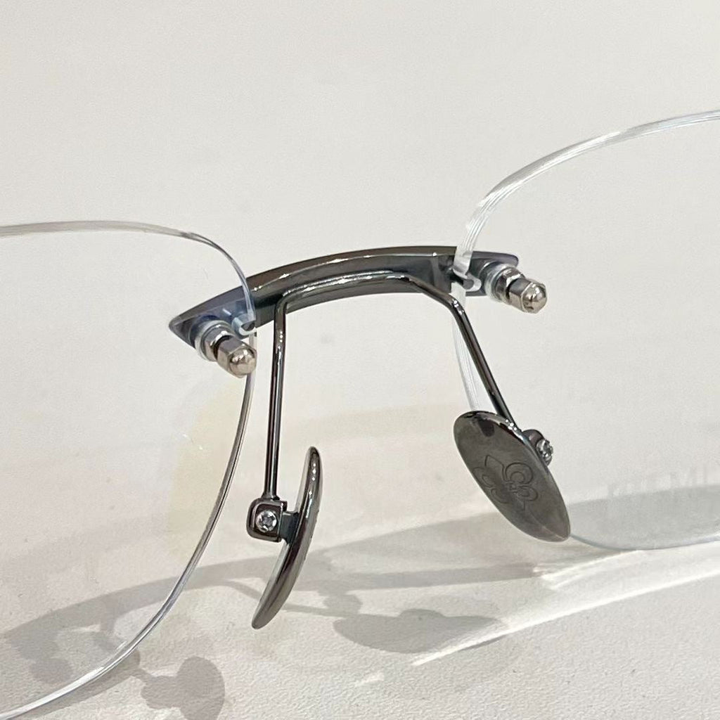Chrome Hearts rimless oval frame glasses